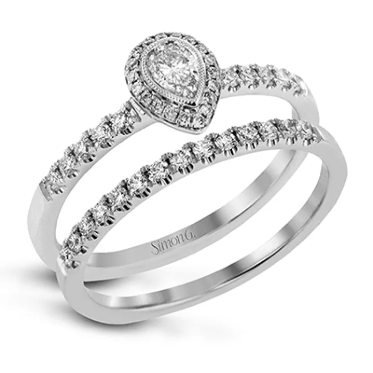 ladies rings stackable fashion set -A refined .18 ct pear shaped diamond shines in this ring set which contains .35 ctw of white diamonds. These rings are perfect for stacking!