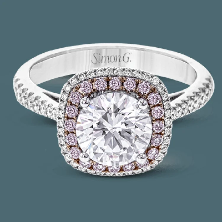 ladies rings with red ruby -This classic style ring is formed from 18k white and rose gold. The halo design is set with .25 ctw of white diamonds as well as .18 ctw of pink diamonds.