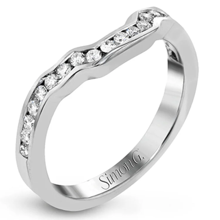 ladies rings for stylish women -Featuring a lovely romantic setting, this white gold contemporary ring features an exquisite halo and .33 ctw of shimmering round cut white diamonds complemented by .34 ctw of trapezoid side diamonds.