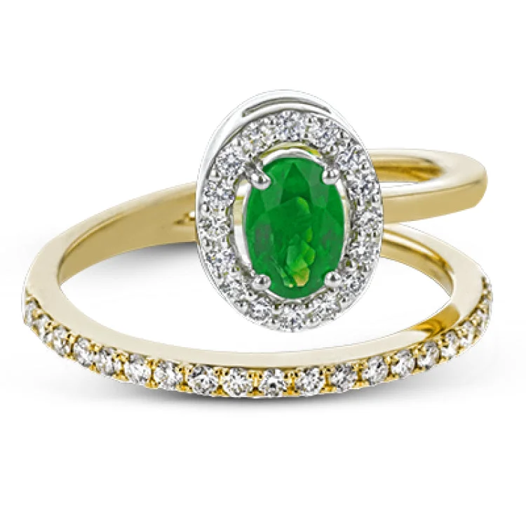 ladies rings for engagement moment -This exceptional ring crafted from 18k yellow gold is set with an oval shaped emerald and .33 ctw of white diamonds.