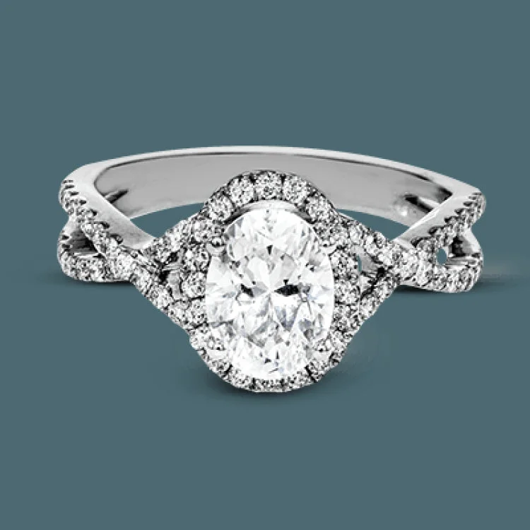 ladies rings with birthstone glow -Delicate yet substantial, this white gold ring accentuates an oval shaped centerpiece with .43 ctw of round white diamond accents.