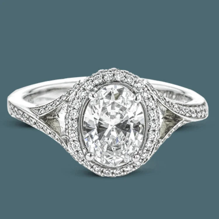 ladies rings lightweight comfort -Elegant and sophisticated, this white gold ring's delicate halo and split shank glitter with .28 ctw of round white diamonds to highlight an oval shaped center stone.