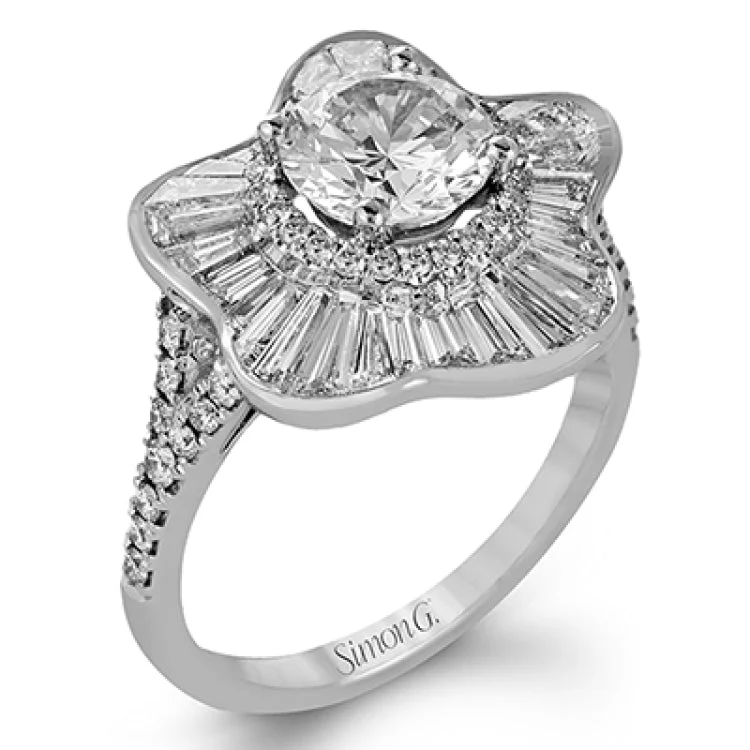 ladies rings floral pattern beauty -This modern white gold ring features an eye-catching floral design set with .19 ctw of round cut white diamonds complemented by .13 ctw pink diamond accents and 1.23 ctw of baguette cut diamonds.