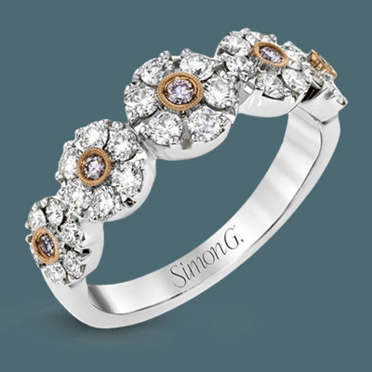 ladies rings with arrow design -This whimsical white gold ring features .78 ctw of round white diamonds accentuated by .07 ctw of round pink diamonds as well as rose gold details in a playful floral design.