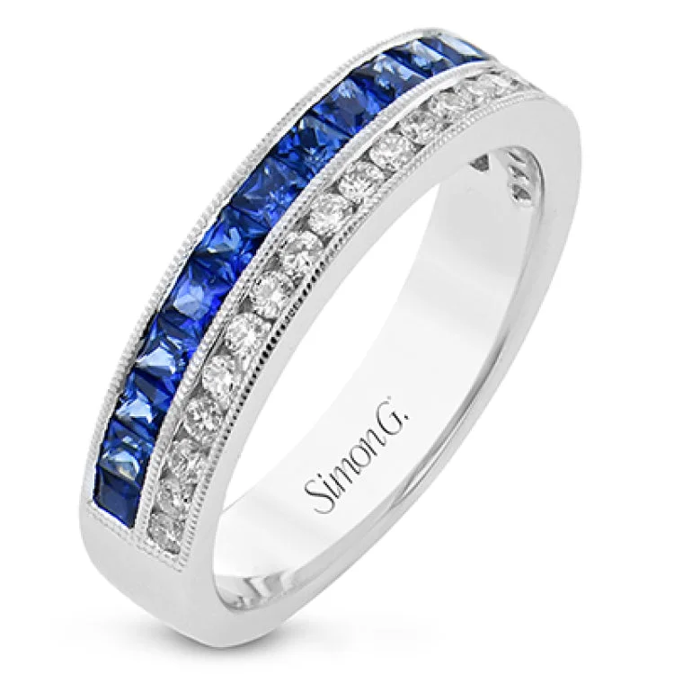 ladies rings for gifting ideas -This white gold right hand ring sparkles with two rows of gems. A row of white diamonds 0.27 ctw, and a row of blue sapphires 0.97 ctw. Accented by a delicate beaded edge.