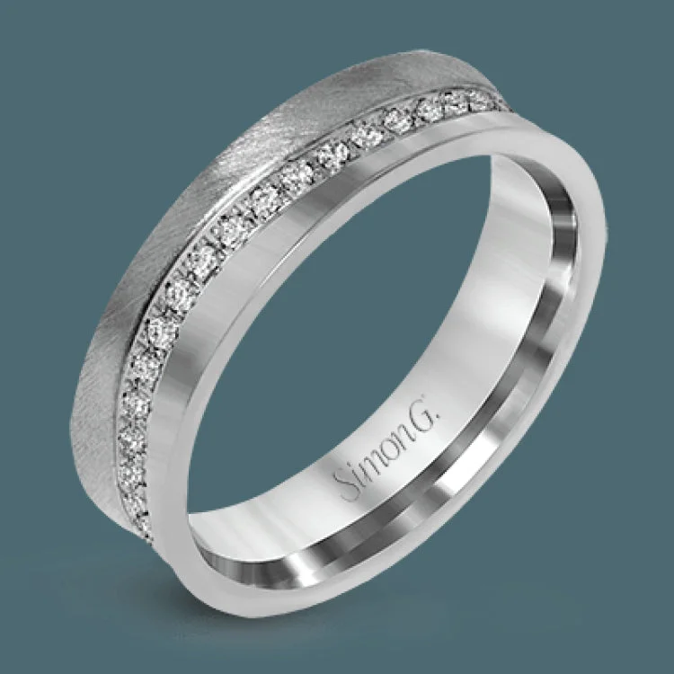 ladies rings for evening wear -This two-toned unisex ring has a row of diamonds down the center totaling .36 ctw, and white gold on one side, and rose gold on the other.