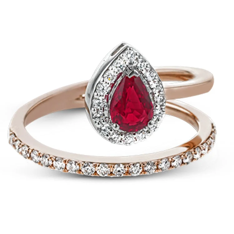 ladies rings for stylish women -This lovely 18k rose gold ring contains .47 ct pear shaped ruby surrounded by .33 ctw of white diamonds.