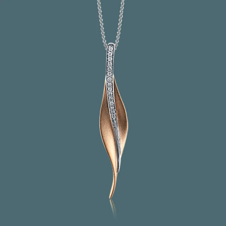 ladies rings with blue topaz -Featuring a contemporary leaf-like design, this striking yellow gold pendant contains a brilliant pilaster of .13 ctw shimmering round cut white diamonds.