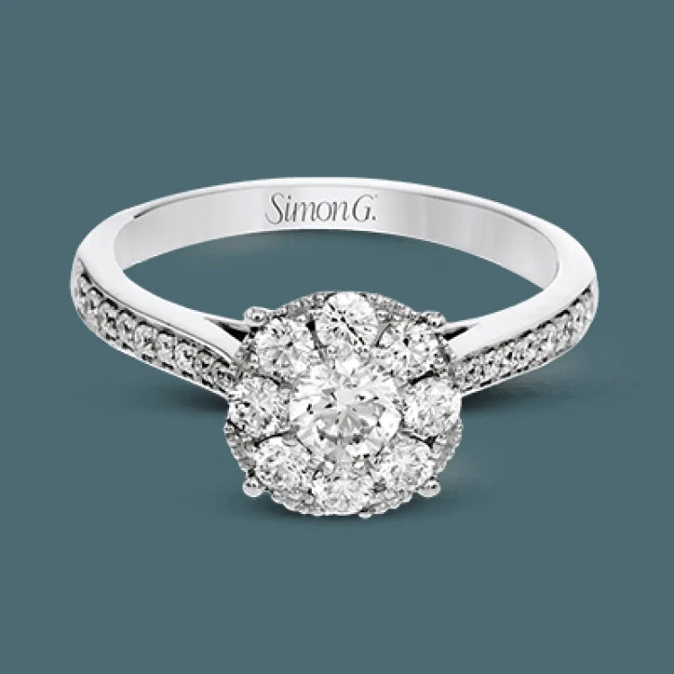 ladies rings with engraving detail -This delightful ring is crafted from 18k white gold and features a .30 ct white diamond in the center of .50 ctw of smaller round white diamonds.