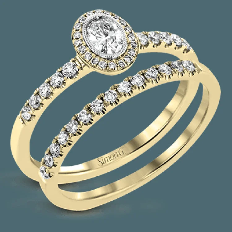 ladies rings promise ring design -A .18 ct oval center diamond in a halo is the focus of this darling set of rings, while .37 ctw of pave set diamonds are the final perfecting touch.