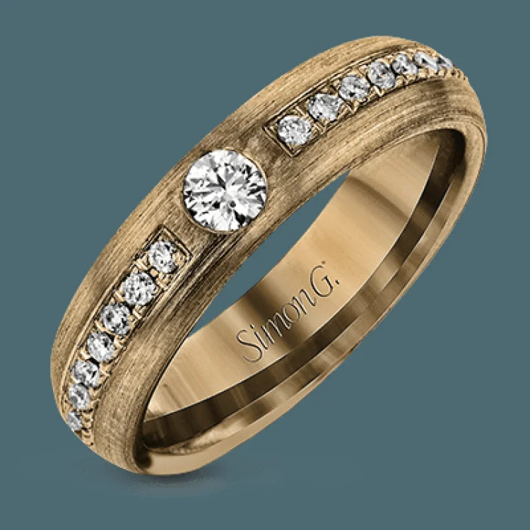 ladies rings stylish affordable -This unisex statement ring features a center bezel set diamond 0.15 ctw, with channel set diamonds down the middle totaling .36 ctw. The exterior of the ring is white gold and the inside is rose gold.