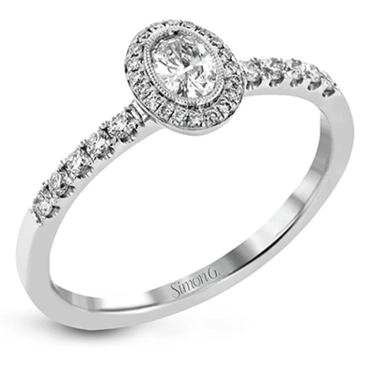 ladies rings thin band elegance -A .18 ct oval center diamond in a halo is the focus of this darling set of rings, while .37 ctw of pave set diamonds are the final perfecting touch.