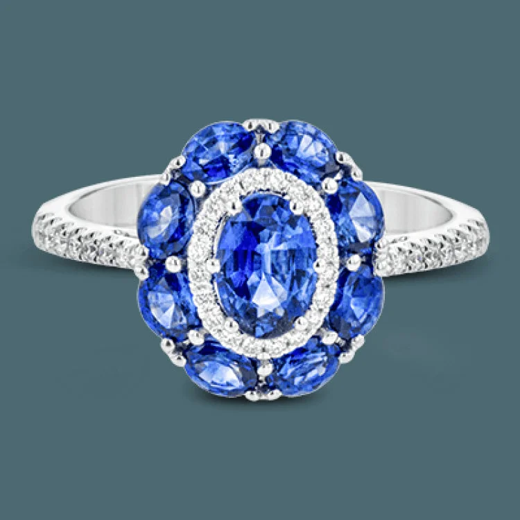 ladies rings eternity band style -This gemstone ring is the perfect addition to any look, with a 1.52 ct sapphire center stone surrounded my .77 ctw oval sapphires and .21 ctw of white diamonds.