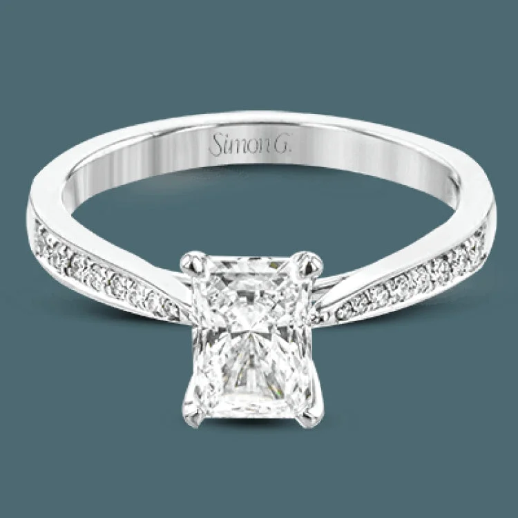 ladies rings with diamond sparkle -The delicate, understated design of this lovely white gold ring is elevated by .27 ctw of round white diamond accents.