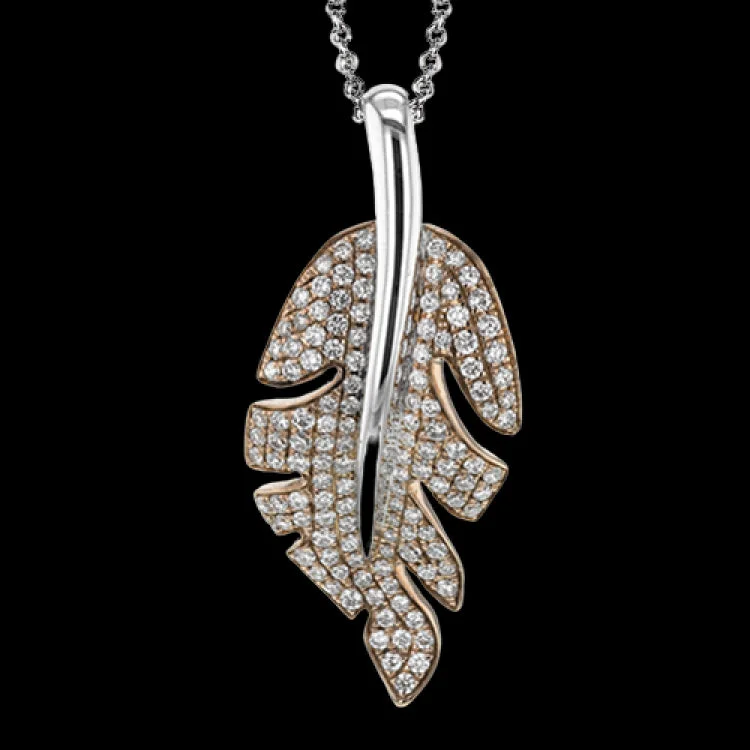 ladies rings for vintage charm -This white and rose gold pendant's flowing, organic design is highlighted by the .51 ctw of round white diamonds glimmering from its surface.