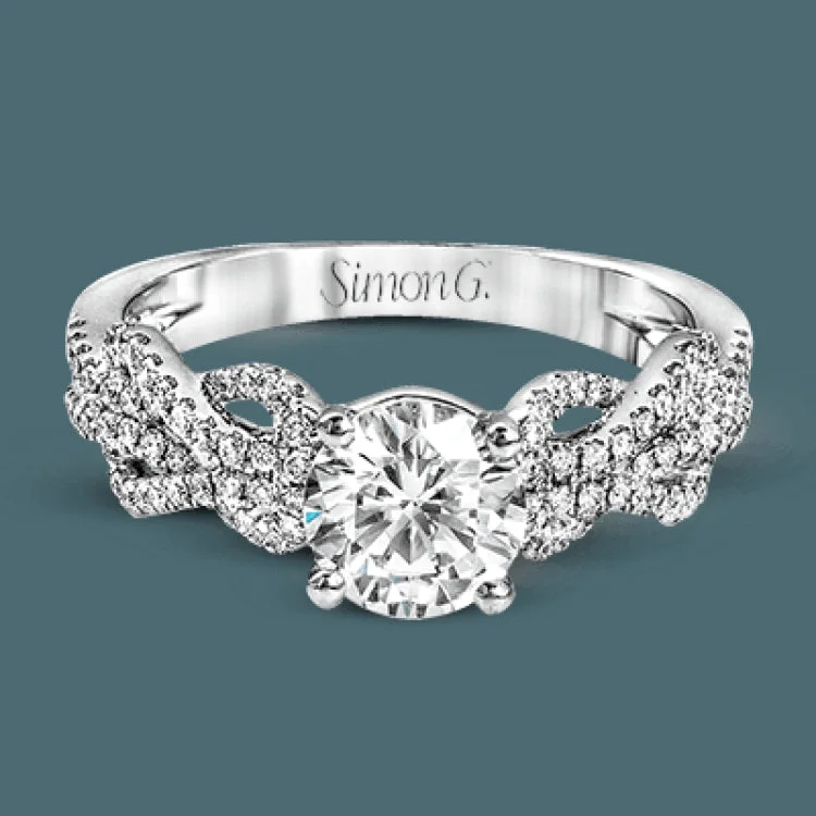 ladies rings trendy minimalist vibe -This distinctive 18k white gold ring has an intricate design reminiscent of lover's knots and eternity symbols, set with .33 ctw of white diamonds.