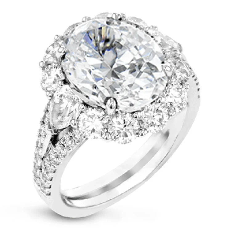 ladies rings affordable luxury -This stunning  right hand ring features a 6.09 ctw sapphire center, surrounded by 1.06 ctw of round brilliant diamonds, and 2 pear shaped diamonds 0.60 cttw.