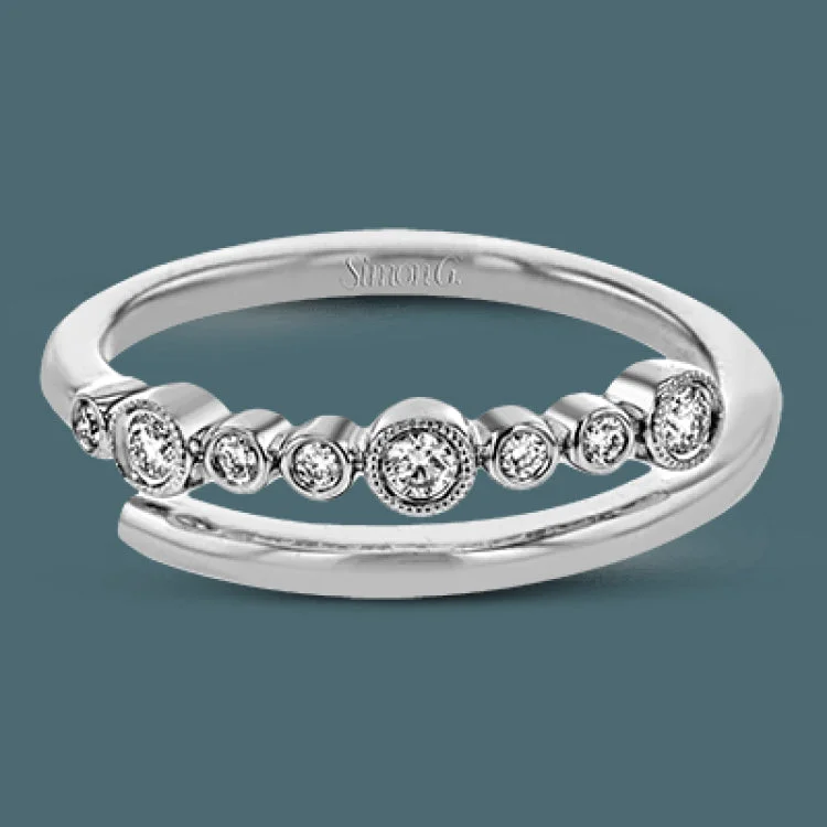 ladies rings for engagement moment -This layered fashion ring design provides the perfect touch with .12 ctw of bezel set diamonds.