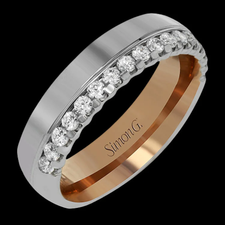 ladies rings modern sleek look -This modern unisex band features a statement row of diamonds totaling .47 ctw along one edge of the ring. The outside of the ring is crafted in white gold while the inside is rose gold.