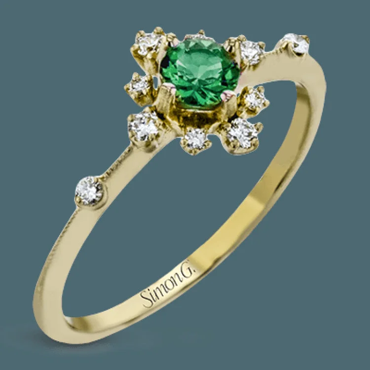 ladies rings timeless beauty -This charming 18k yellow gold ring is perfect for stacking and contains a .35 ct center tsavorite stone and .13 ctw accent diamonds.