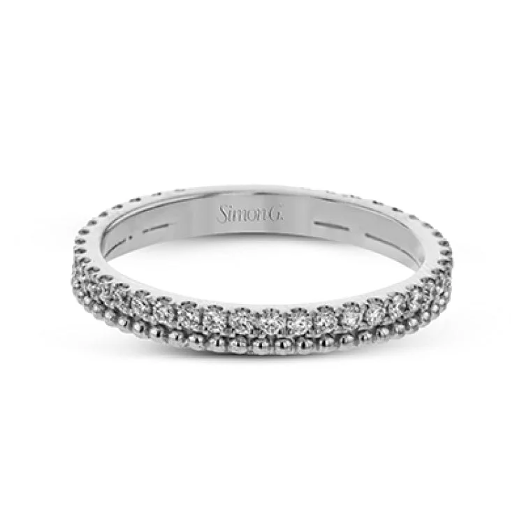 ladies rings for special occasions -A line of .33 ctw of white diamonds sits alongside a row of granulation in this band that adds the ideal touch of shine. Perfect for stacking with other rings.