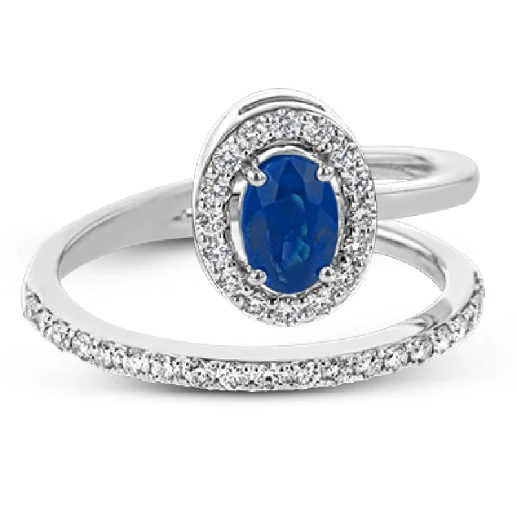 ladies rings rose gold trendy -An oval shaped blue sapphire is the star of this 18k white gold ring, set with .32 ctw of white diamonds.