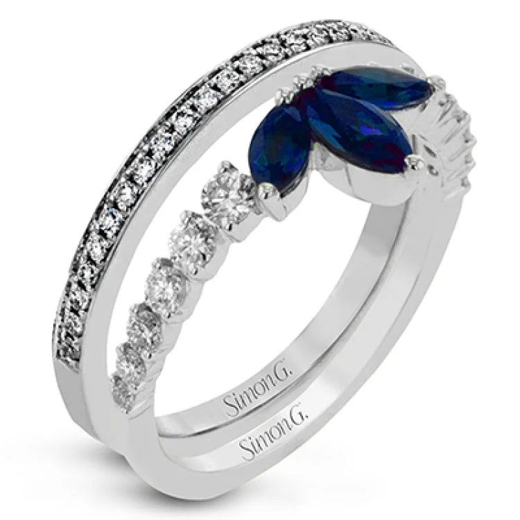 ladies rings romantic delicate style -This 18k white gold ring creates the look of two rings in one, with a center design of .66 ctw of sapphires accented by .61 ctw of white diamonds.