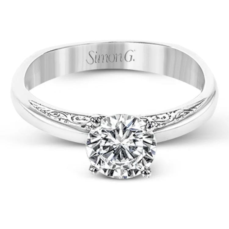 ladies rings for young women -Beautiful in its simplicity, this sleek white gold ring accentuates its centerpiece with delicate engraved details on either side.