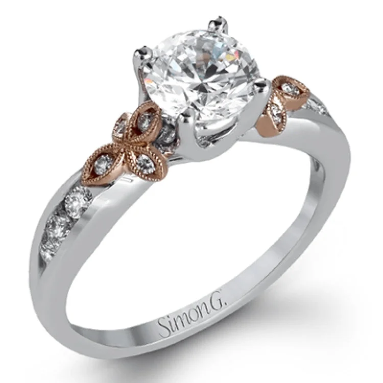 ladies rings white gold finish -This delicate white gold ring features lovely rose gold accents on the shank and is set with .24 ctw of round cut white diamond accents.