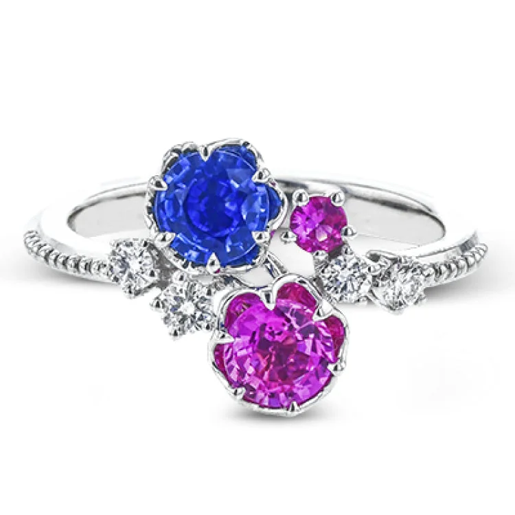 ladies rings for evening wear -Crafted in 18k white gold, this distinctive fashion ring showcases multiple sapphires in beautiful tones of blue and pink.