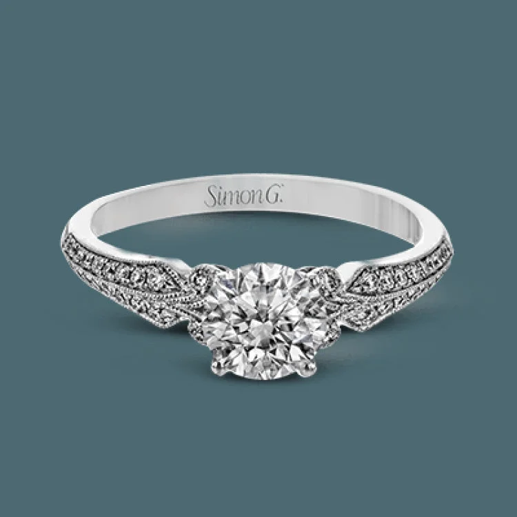 ladies rings floral pattern beauty -This remarkable white gold ring features .18 ctw of round white diamonds and delicate milgrain edging for a sleek, romantic look.