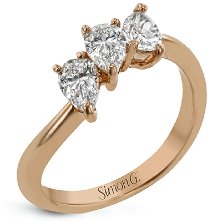 ladies rings budget friendly luxury -This ring provides a distinctive take on a three stone ring that can be worn on an every day basis, with three pear shaped diamonds totaling .91 ctw nestled together.