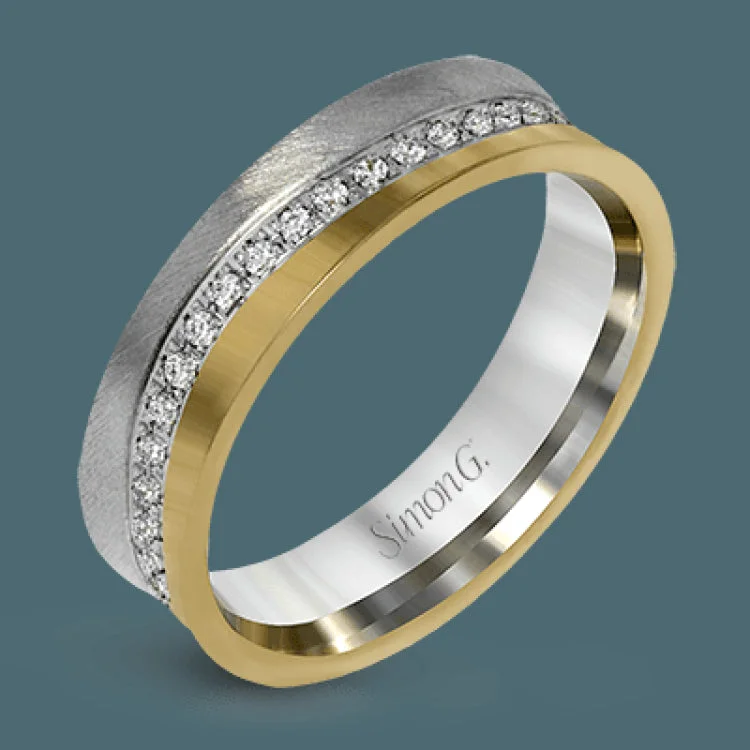 ladies rings for fashion lovers -This two-toned unisex ring has a row of diamonds down the center totaling .36 ctw, and white gold on one side, and rose gold on the other.