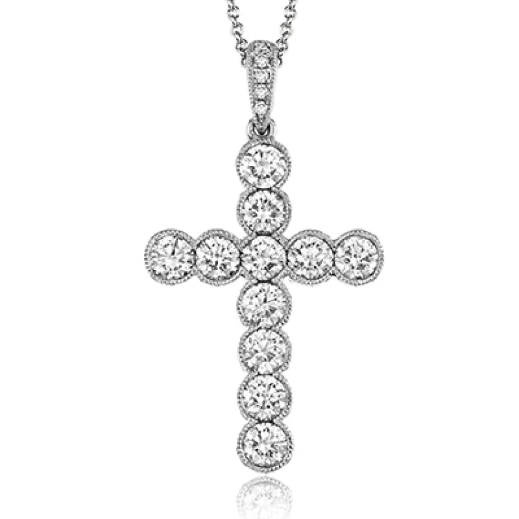 ladies rings dramatic bold style -This classic white gold cross pendant is elevated with the presence of 1.53 ctw glimmering round cut white diamonds accents.