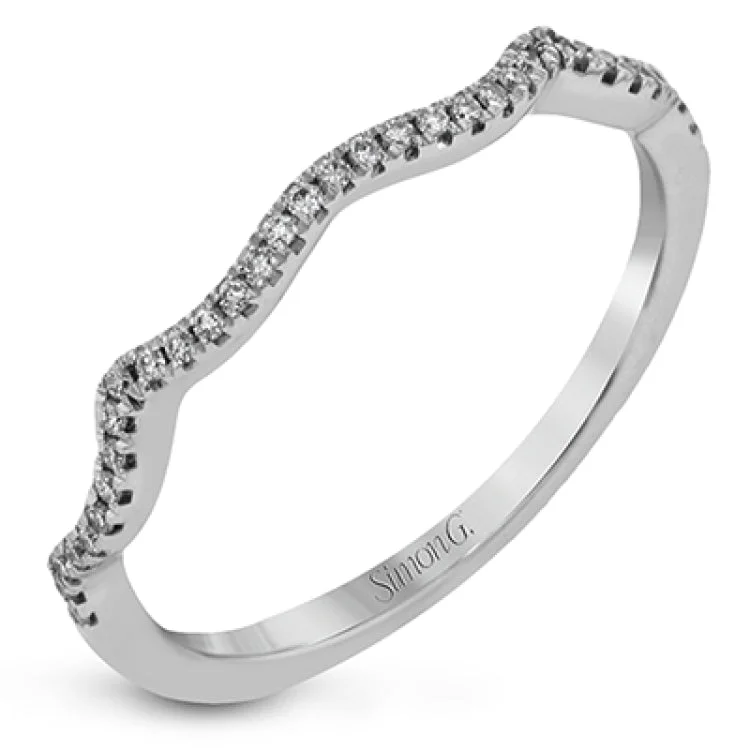 ladies rings for bold fashion -The dramatic geometric halo of this modern white gold ring is highlighted by .29 ctw round cut white diamonds and accented with .35 ctw baguette cut diamonds, .14 ctw princess cut diamonds and .05 ctw marquise cut diamonds.