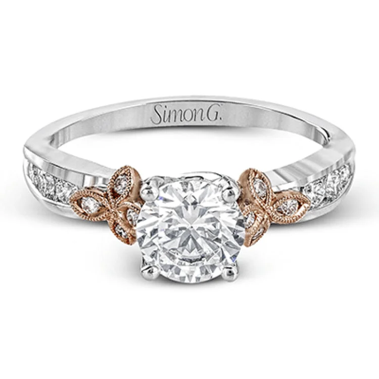 ladies rings custom personalized -This delicate white gold ring features lovely rose gold accents on the shank and is set with .24 ctw of round cut white diamond accents.