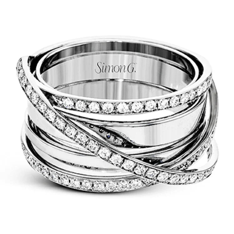 ladies rings handmade unique -This modern, dynamic ring features an overlapping design of shiny high polished 18k white gold and rows of sparking white diamonds. The ring contains .50 ctw of round diamonds.