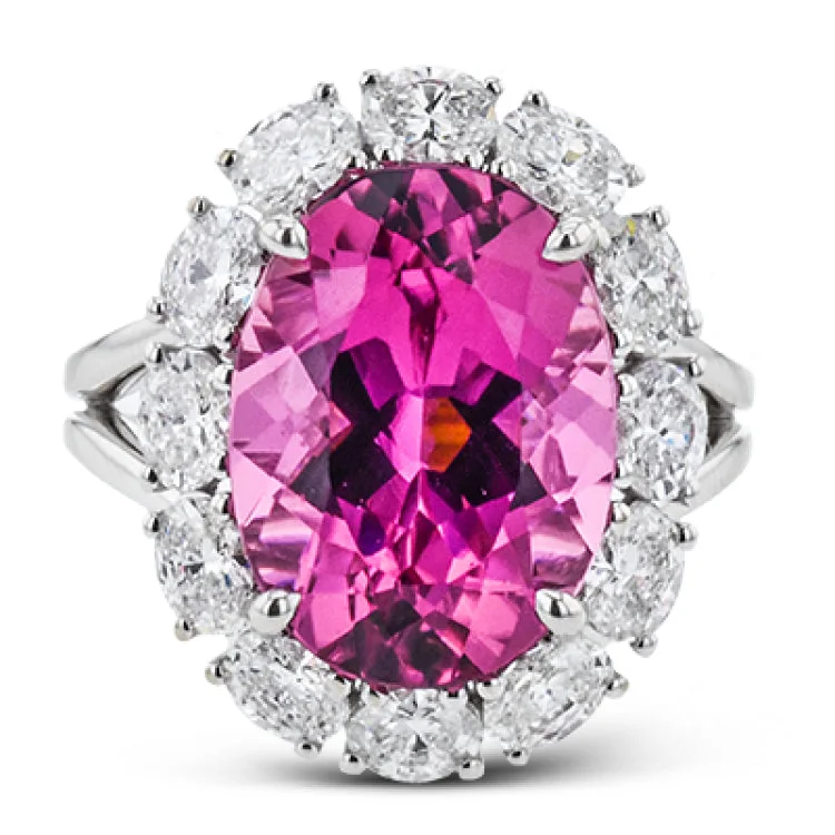 ladies rings chic modern design -This 18k white gold ring showcases a beautiful deep pink 8.12 ct tourmaline, surrounded by a halo of diamonds.