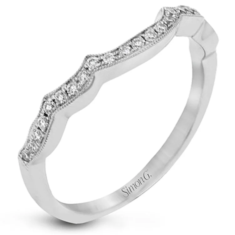 ladies rings luxury brand appeal -The lovely vintage design of this impressive white gold ring is emphasized by .27 ctw sparkling round cut white diamonds.