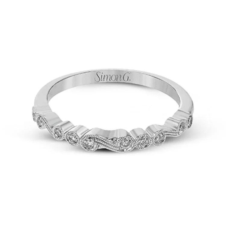 ladies rings budget friendly luxury -This vintage inspired 18k white gold ring contains .11 ctw of round white diamonds in a delicate swirling design. Perfect for stacking.