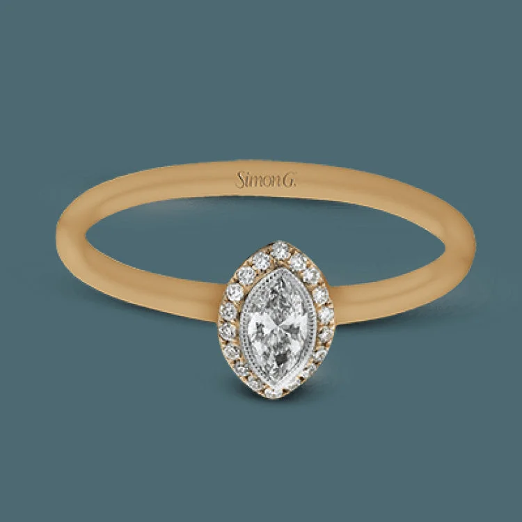 ladies rings promise ring design -This exquisite, minimalist rose gold ring features a halo containing .06 ctw of round white diamonds encircling a .16 ctw marquise shaped white diamond