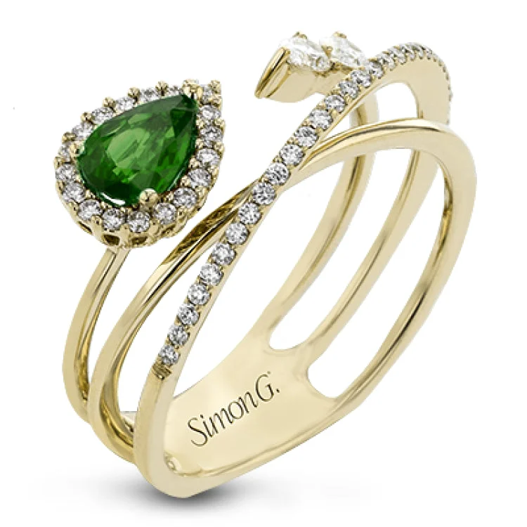 ladies rings simple delicate charm -This 18k yellow gold ring is set with a lovely .42 ctw green pear shaped emerald and .34 ctw of white diamonds.